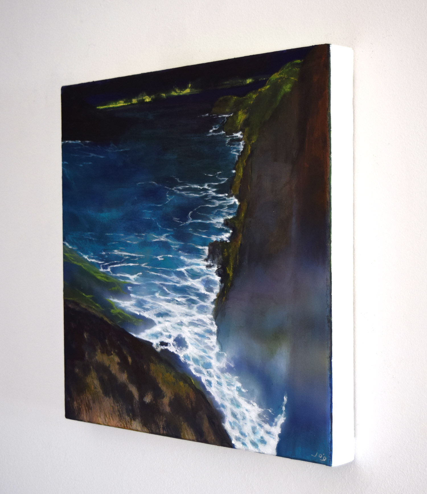 Sideview of 'The Edge of the Deep Green Sea III' painting by John O'Grady A seascape with waves crashing against a cliff face